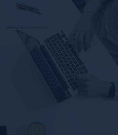 person typing on laptop