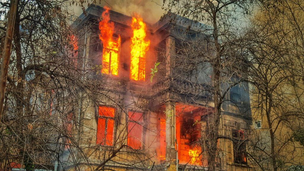 Severely fire-damaged rental apartment interior — visual of personal-property loss for renters’ insurance coverage